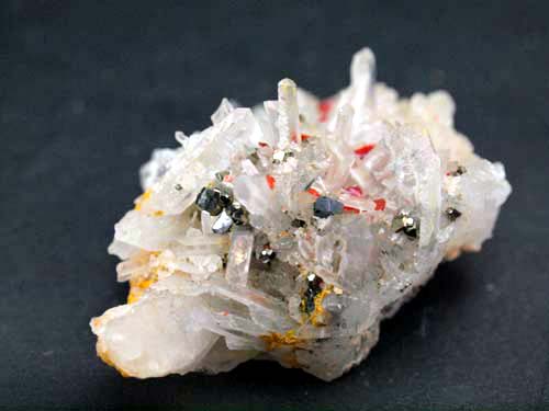 Quartz crystals with realgar crystals on it and pyrite crystals.<br>Size 3cm x 4cm x 2cm