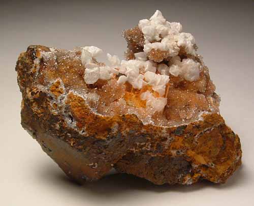 Wulfenite with calcite on quartz Wulfenite with calcite on quartz